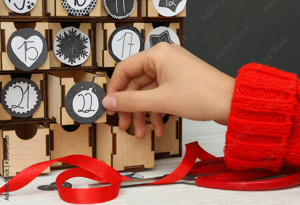 Woman making advent calendar at white wooden table closeup Stock Photo Woman making advent calendar at white wooden table closeup Stock Photo