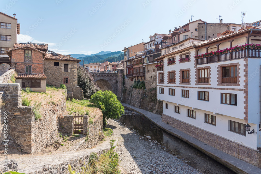 Traditional buildings made of stone on a sunny day in Potes, Cantabria, Spain