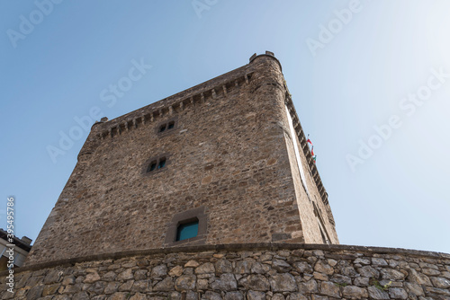 A stone-made historical medieval tower in Potes, Cantabria, Spain under a clear sky