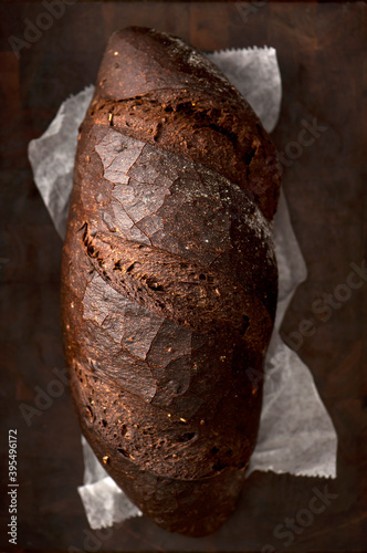 Dark pumpernickel rye bread loaf photo