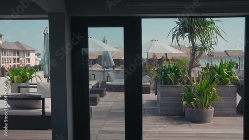 Wallpaper Mural Pan of soft unoccupied deckchairs with pillows under fluttered umbrellas at luxury open resort terrace Torontodigital.ca