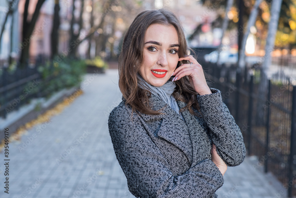 Portrait of a beautiful and happy girl outdoors. Beauty and fashion Portrait of a beautiful and happy girl outdoors. Beauty and fashion
