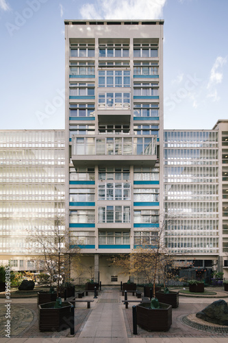 tall architecture residential homes tower facade in winter blue skies in london blue and white