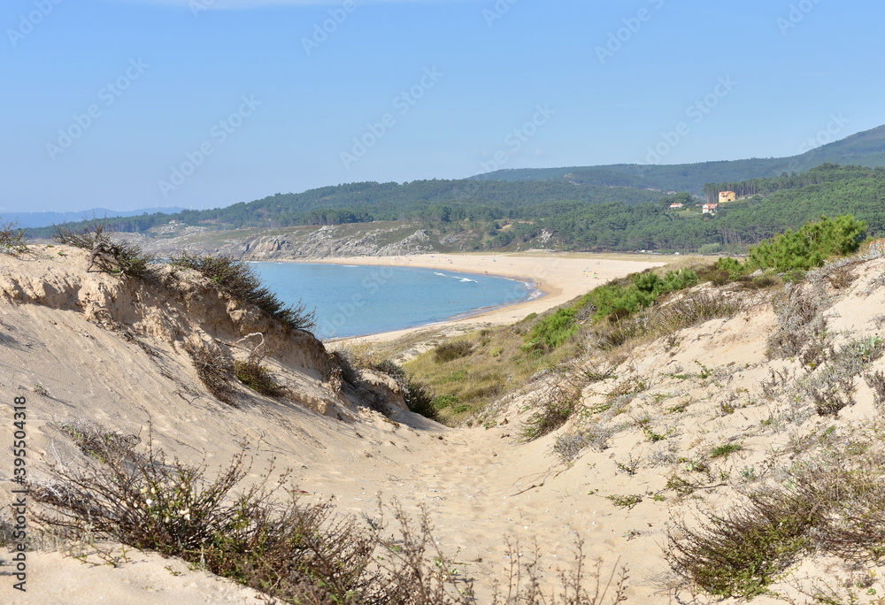 Beach with sand dunes and turquoise water. Porto do Son, Rias Baixas, Coruña, Galicia, Spain. Beach with sand dunes and turquoise water. Porto do Son, Rias Baixas, Coruña, Galicia, Spain.