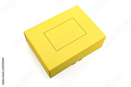 Yellow cardboard parcel isolated on white background