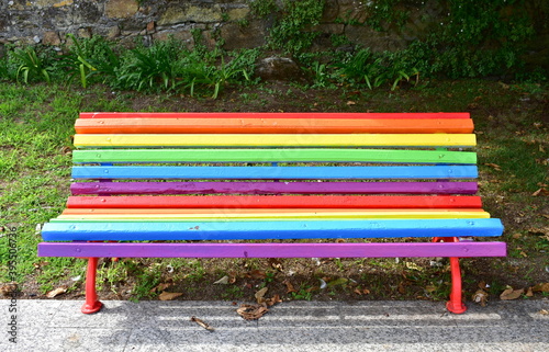 Gay pride bench at public park. Colours of gay rainbow flag. Camariñas, Coruña, Galicia, Spain. photo