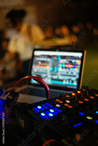 Close up deejay mixer at night club