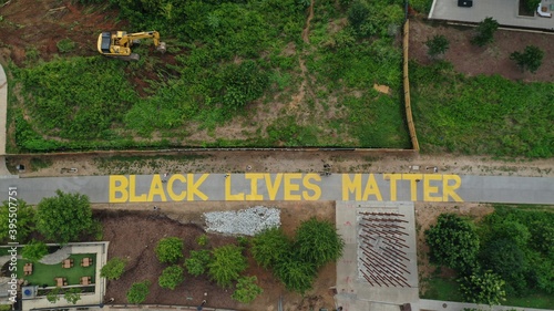 "Black Lives Matter" Written on the Atlanta Beltline in Yellow Letters - Atlanta, GA, Aerial View, 2021