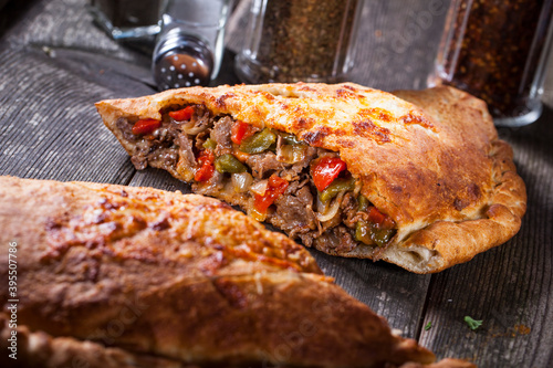 Calzone with meat and peppers photo