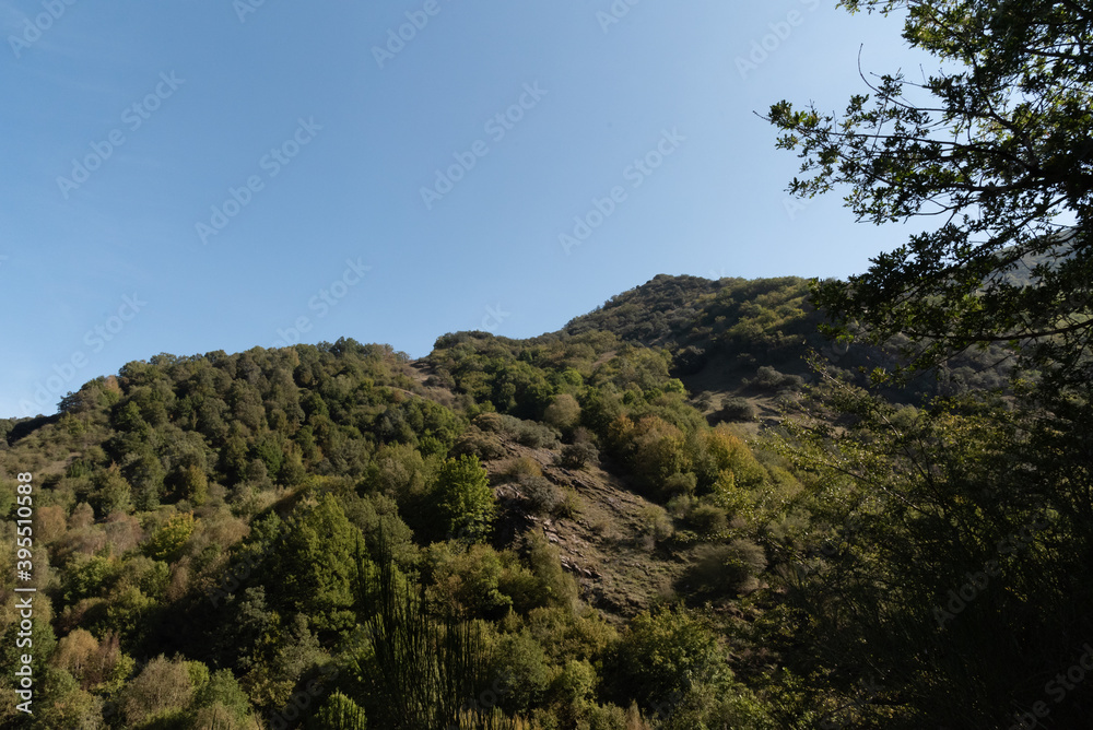 Formigueiros peak Courel hillside with autumn sunlight and blue sky