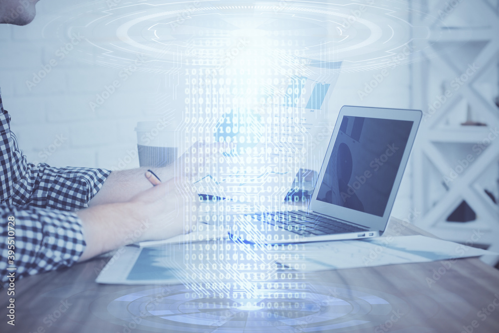 A man working on computer with technology theme drawing. Concept of big data. Multi exposure. A man working on computer with technology theme drawing. Concept of big data. Multi exposure.