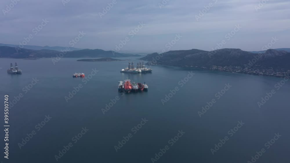 Tanker moored for unloading. Tanker parking. Fuel transfer. Greece. The bay. Tanker moored for unloading. Tanker parking. Fuel transfer. Greece. The bay.