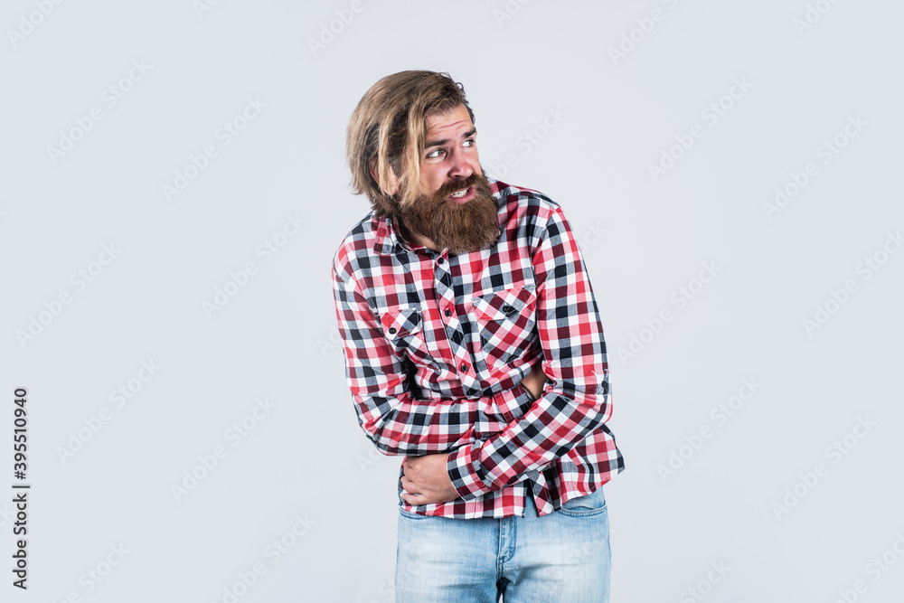 Caucasian mature hipster with trendy hairstyle in checkered shirt having stomach ache, treatment Caucasian mature hipster with trendy hairstyle in checkered shirt having stomach ache, treatment
