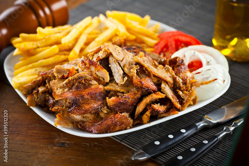 Greek pork gyros served with fried potatoes