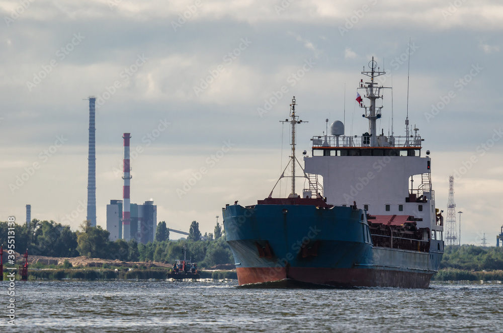 Fototapeta premium MERCHANT VESSEL - Ship on the background of the coast with industrial chimneys
