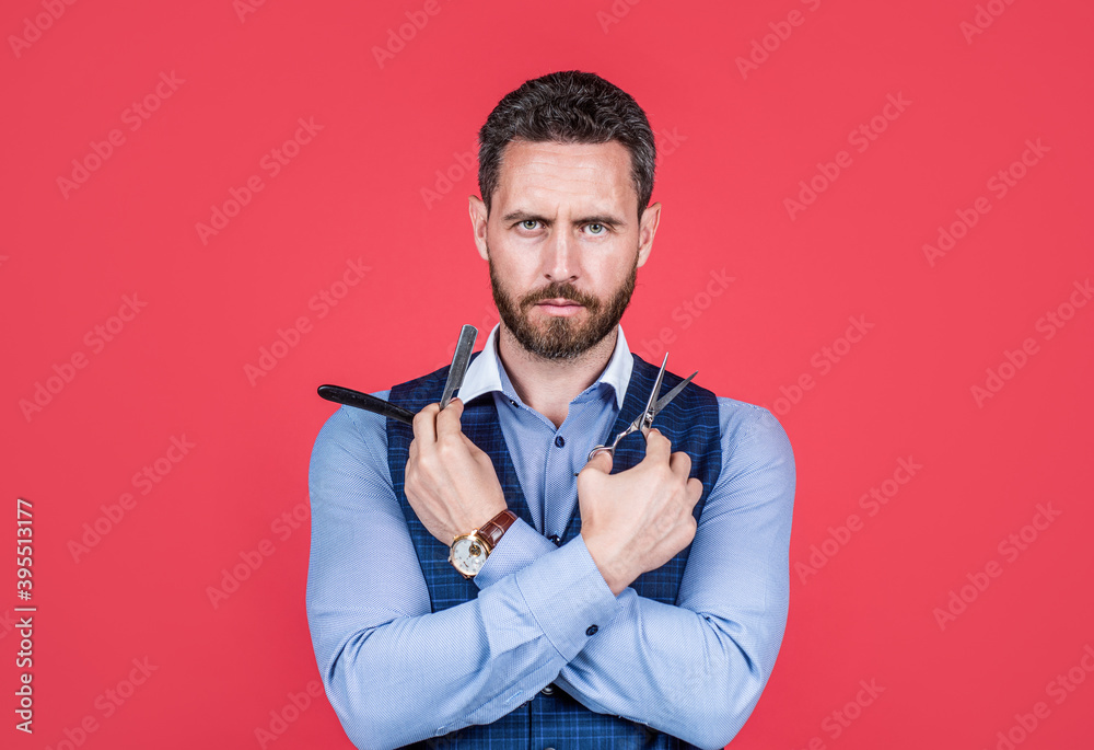 Bearded man hold retro barber tools for cutting and shaving red background, barbering Bearded man hold retro barber tools for cutting and shaving red background, barbering