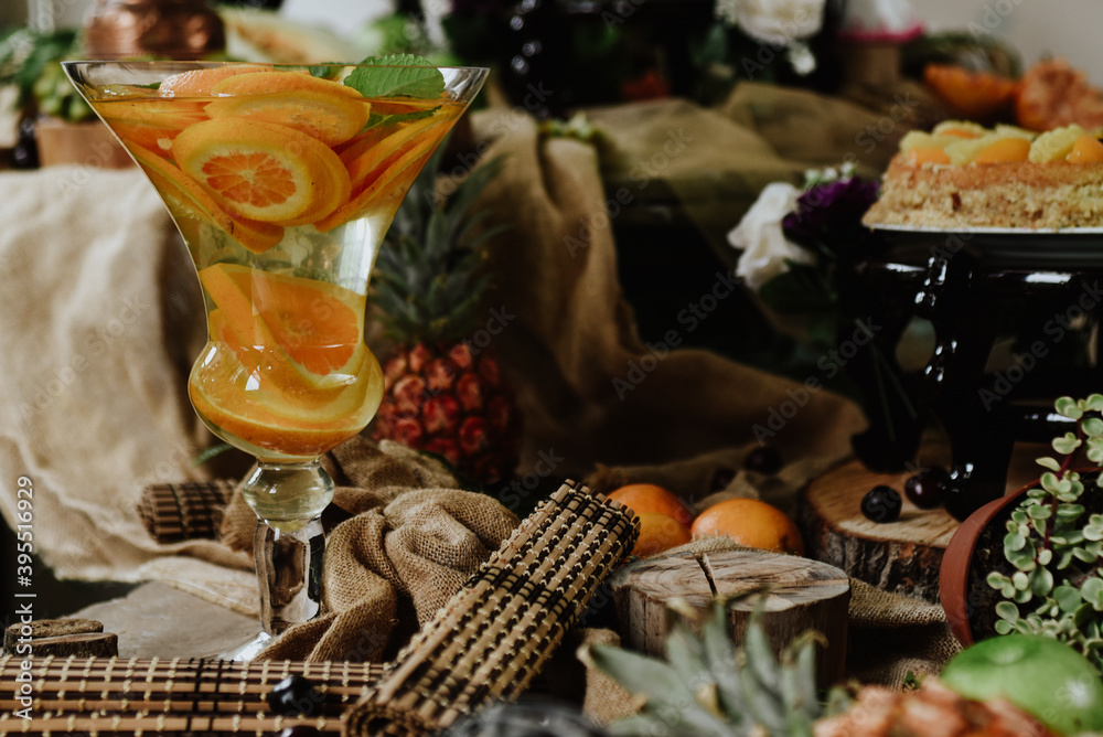 Obraz premium still life with wine and fruits. Table with all kinds of tropical fruits