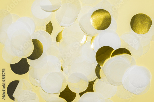 white and gold paper confetti pastel yellow background frame toned