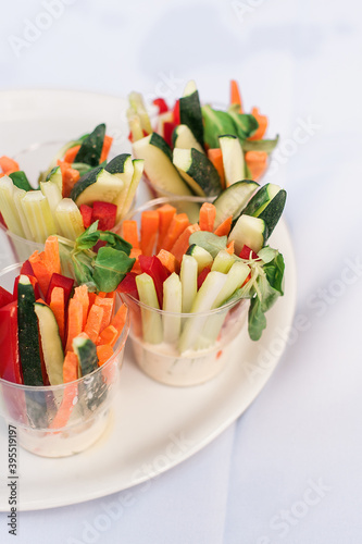 Vegetarian snacks on white plate. Healthy buffet. Homemade holiday celebration event. Catering party