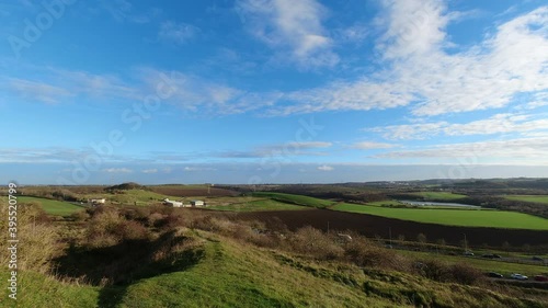 4k timelapse footage of the very beautiful Herrington Country Park taken from the top of Penshaw Hill, Sunderland UK set against a blue vivid sky with stunning clouds.
