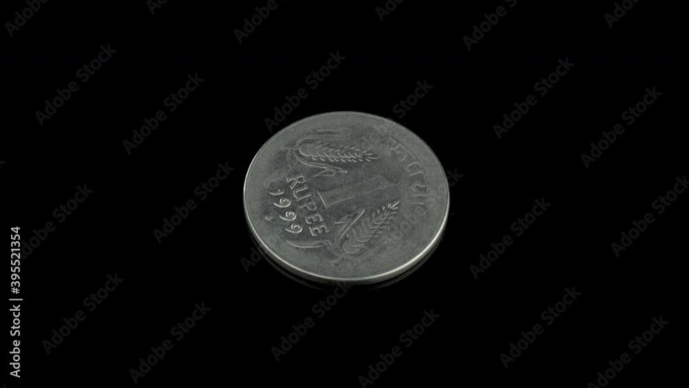 Indian 1 rupee of 1999 coin on a black background Indian 1 rupee of 1999 coin on a black background