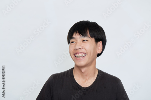 young Asian man making a confident