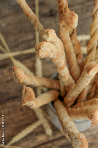 Italian grissini, bread sticks, italian appetizer. Wooden table