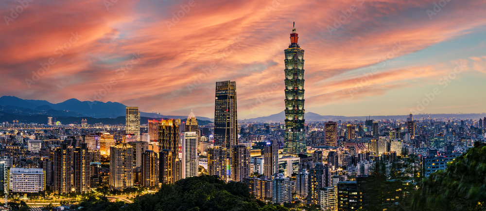 View from above, stunning view of the Taipei City skyline illuminated during a beautiful sunset. Panoramic view from the Mount Elephant in Taipei, Taiwan.