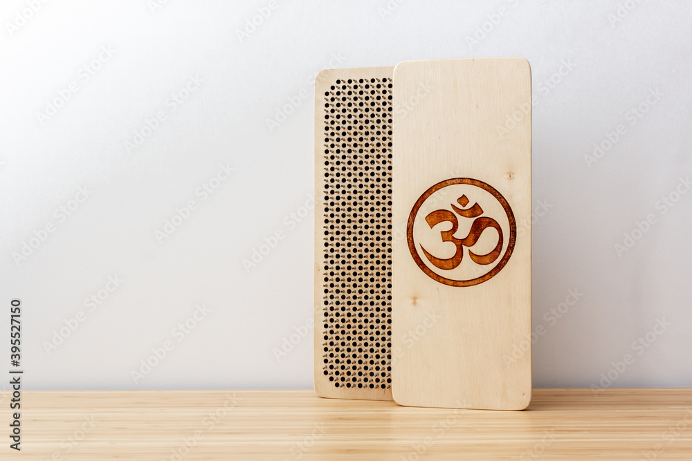Sadhu wooden board with nails for sadhu practice. On bamboo desk and white background. Sadhu wooden board with nails for sadhu practice. On bamboo desk and white background.