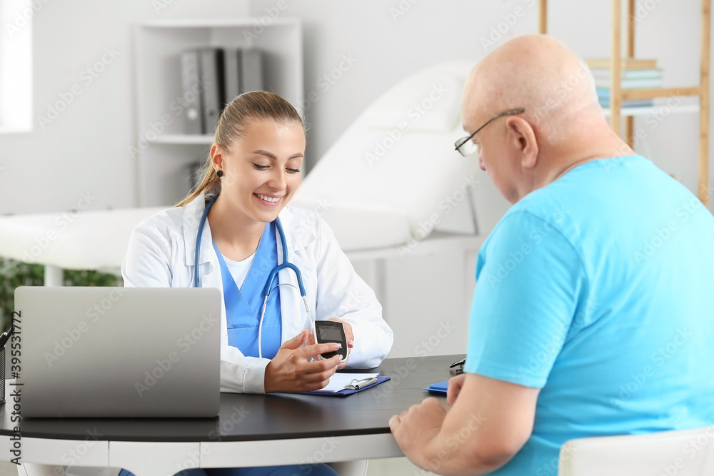 Senior diabetic man visiting doctor in clinic