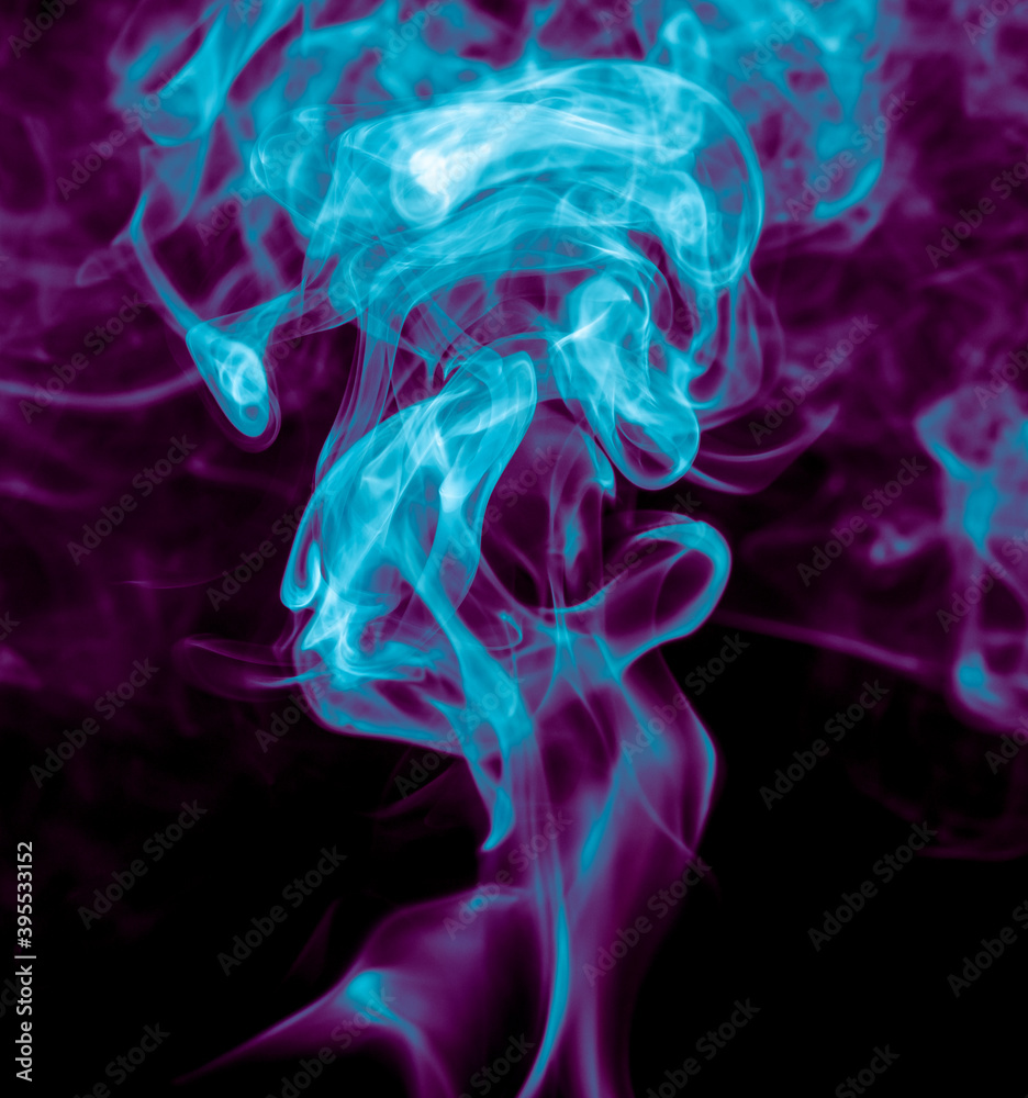 Obraz premium Purple and blue smoke isolated on black background. Abstraction