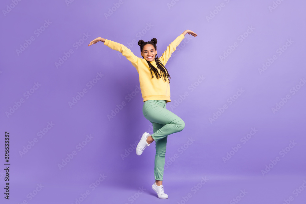 Full size photo of hooray cool lady dance wear yellow sweater trousers sneakers isolated on lilac color background