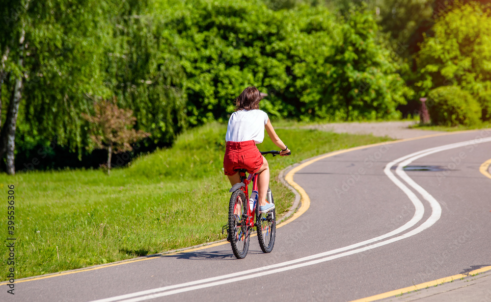 Cyclist ride on the bike path in the city Park
