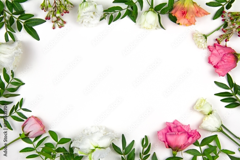 Flower arrangement. Pink and white flowers on a white background. Valentine's day. Flat lay, top view, copy space.
