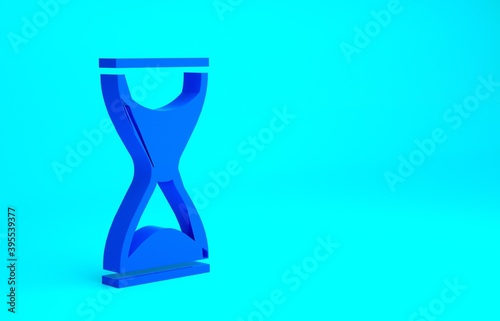 Blue Old hourglass with flowing sand icon isolated on blue background. Sand clock sign. Business and time management concept. Minimalism concept. 3d illustration 3D render.