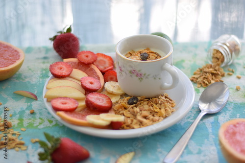 Yogurt with seasonal fruits and granola.
