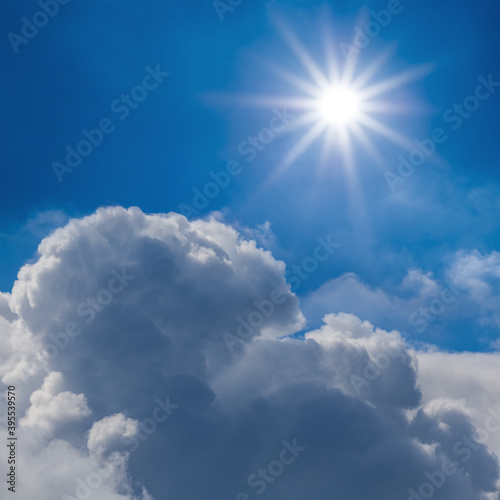 sparkle sun above a dense cumulus clouds  natural skt background