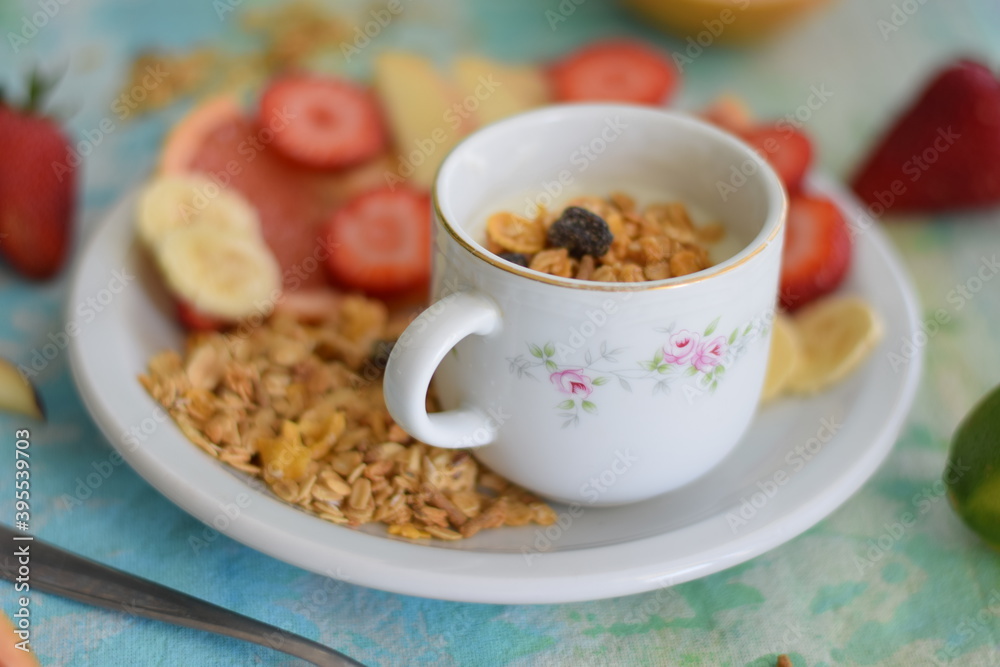 Yogurt with seasonal fruits and granola.