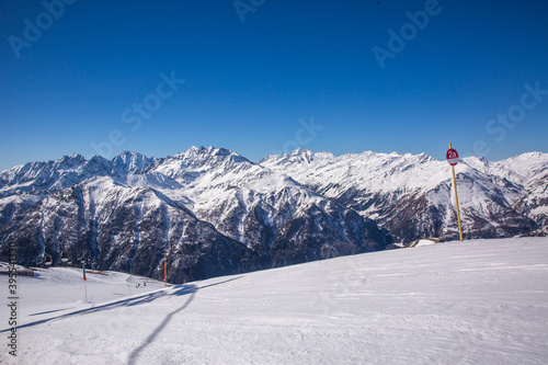 Winter landscape - Panorama of the ski resort with ski slopes. Alps. Austria.