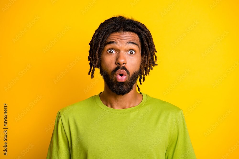 Portrait of impressed dark skin guy shout surprise isolated over vivid yellow color background Portrait of impressed dark skin guy shout surprise isolated over vivid yellow color background