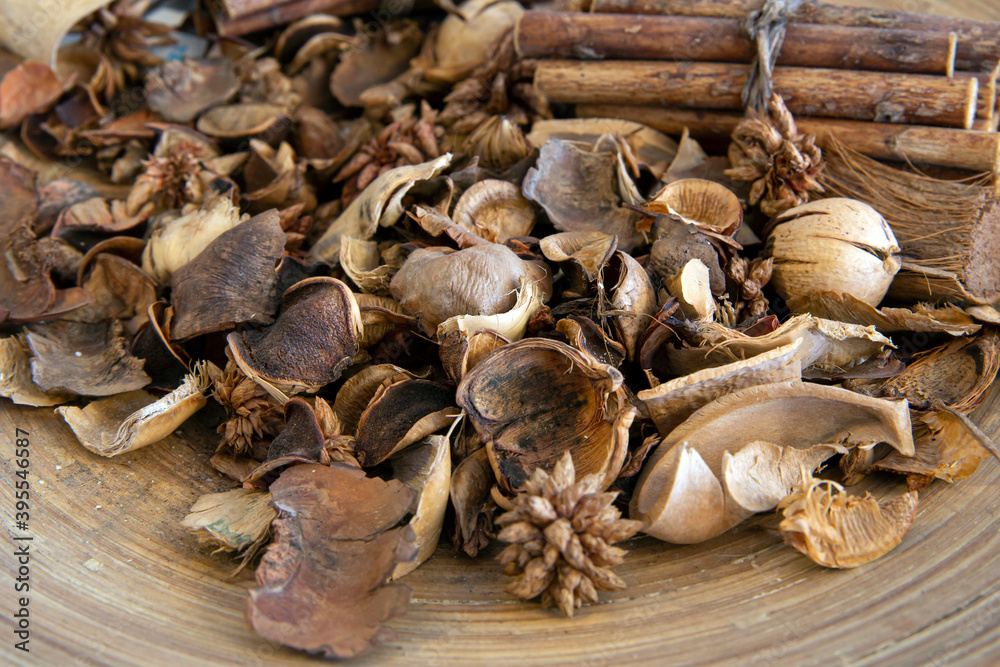 Top view of dried wood pieces in round wooden plate.. Top view of dried wood pieces in round wooden plate..
