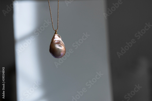 Natural baroque pearl pendant on a chain