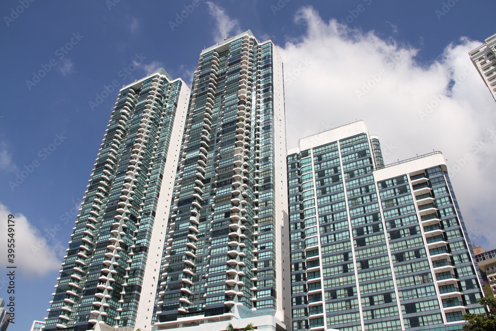 group of skyscrapers with blue sky background with clouds on a summer day group of skyscrapers with blue sky background with clouds on a summer day