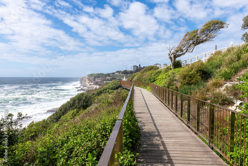 Sydney, Australia - People walking on the Coogee to Bondi coastal walk. This famous coastal walk extends for six km in Sydney's eastern suburbs. The walk features many stunning views.