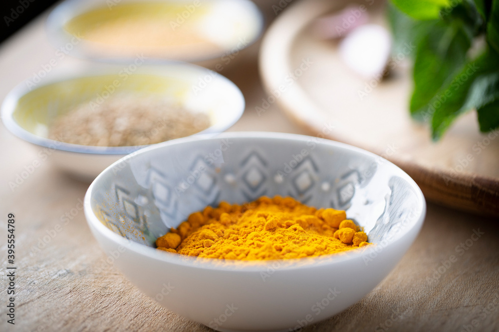 A bowl of turmeric powder A bowl of turmeric powder