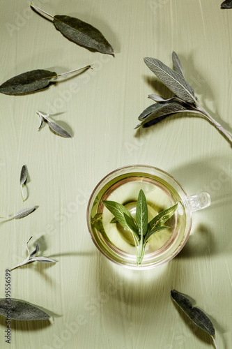 Sage tea in a glass cup photo