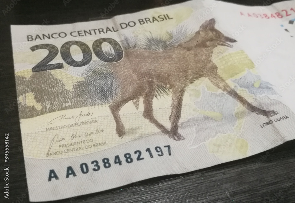 Brazilian 200 reais bank notes. The Maned Wolf on the currency. Two hundred  real from Brazil.