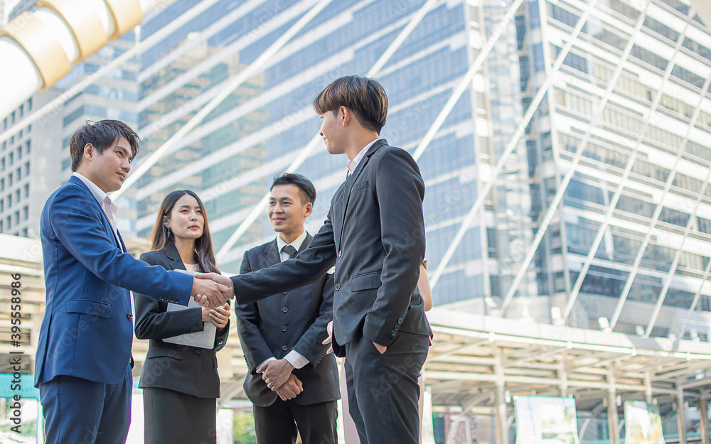 Business men shake hand to deal agreement Business men shake hand to deal agreement