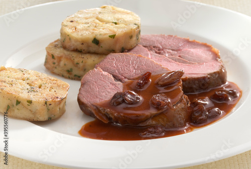 Roe deer sauerbraten with sweet and sour sauce and napkin dumplings photo