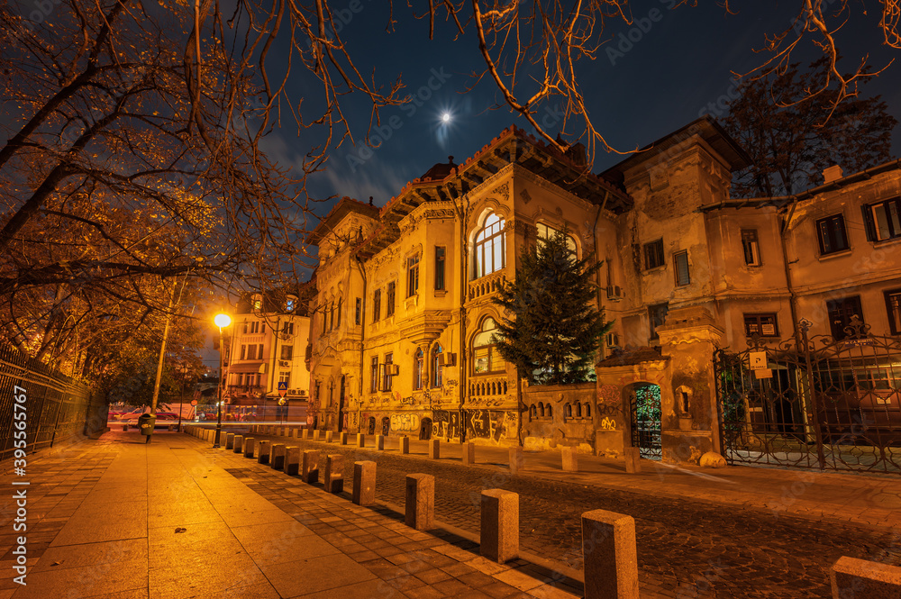 Majestic townhouse in a street in Bucharest downtown by night
